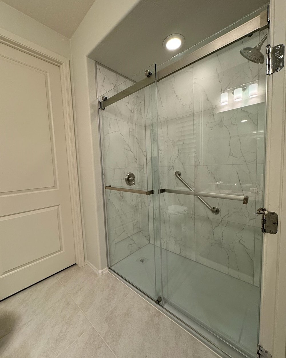 Bianco marble shower install by Made New Home Solutions