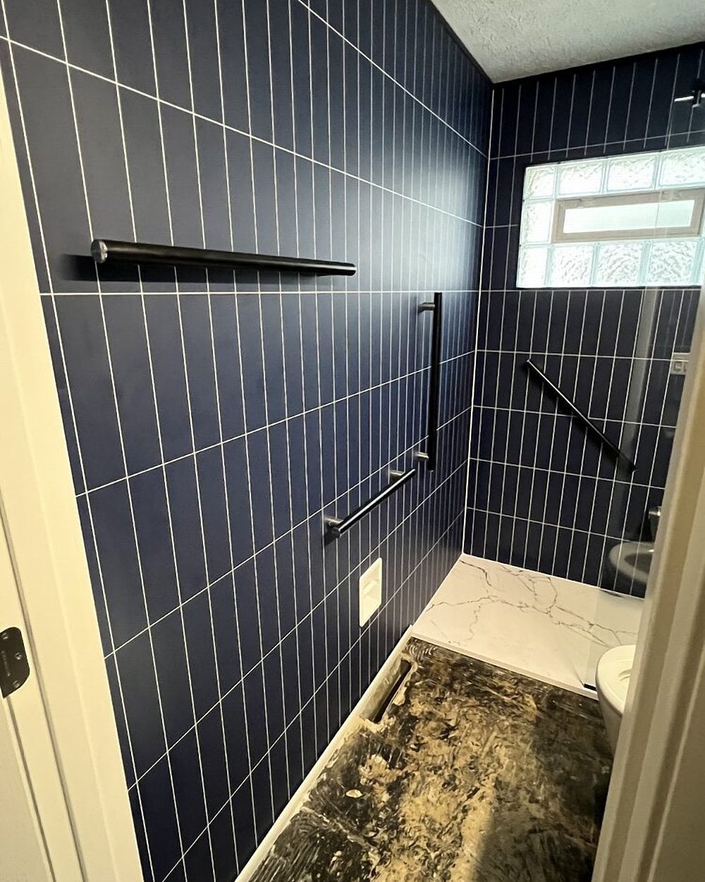 Smokey blue shower install by Made New Home Solutions