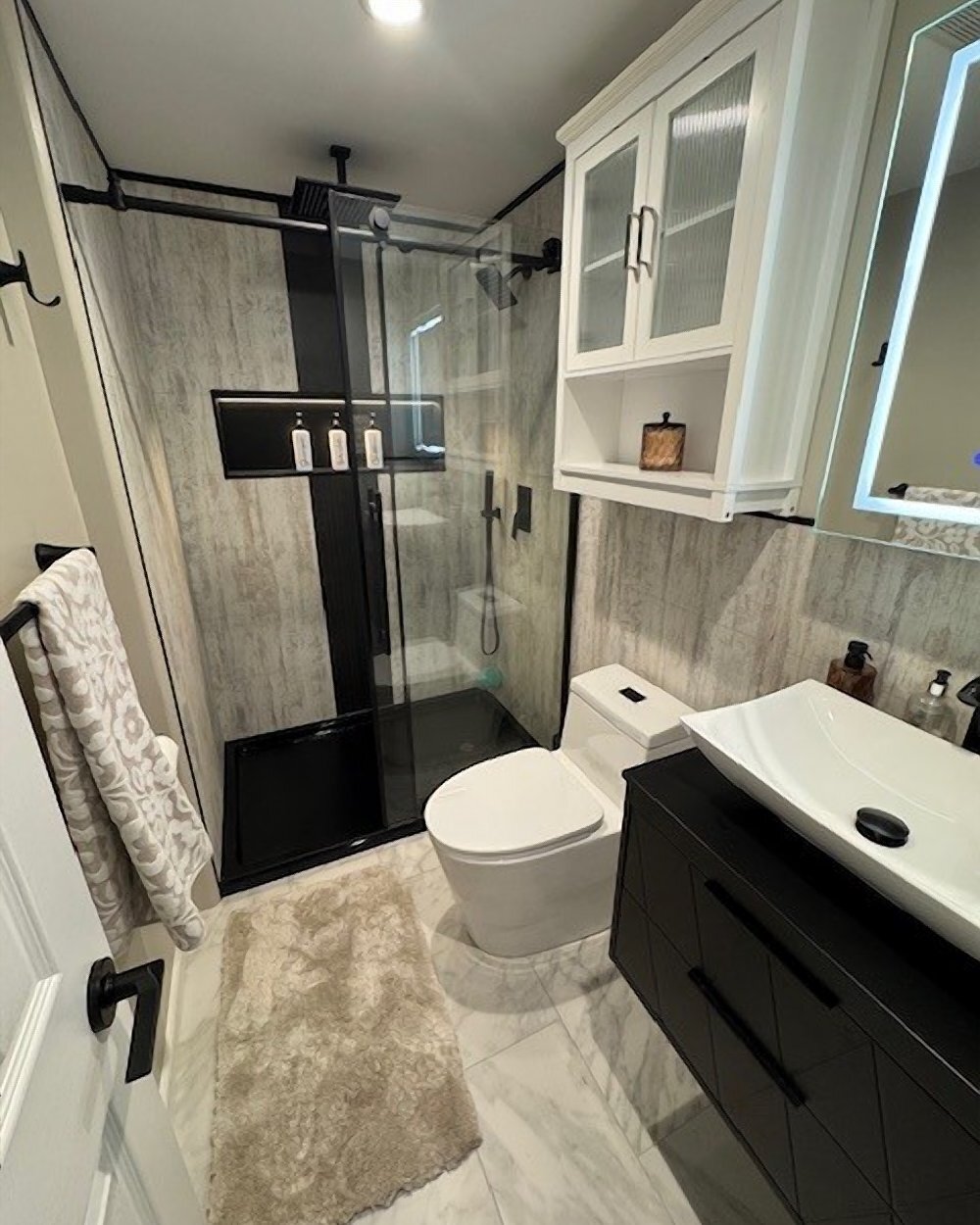 Vertical black shale shower install by Made New Home Solutions
